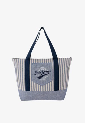 Bolsa tote de rayas azul y crema con asas azul oscuro, un bolsillo delantero con un logo circular y cierre con cremallera.
