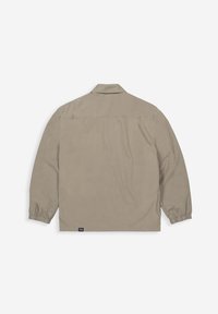 Lichtbeige jack met lange mouwen, kraag, elastische manchetten en een rechte zoom. Heeft een logo-label nabij de onderste linkerkant.