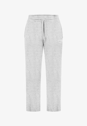 Jasnoszare spodnie dresowe o miękkiej teksturze, zwężane nogawki, elastyczny pas i sznurek do regulacji. Z małym logo z boku.