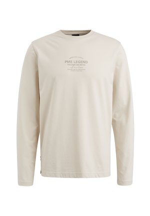 T-shirt beige a maniche lunghe in cotone, con logo stampato al centro. Collo rotondo e vestibilità casual, con spacco sui lati dell'orlo.