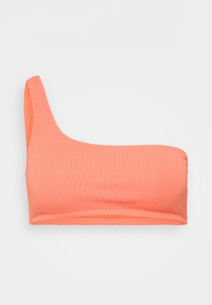 One-shoulder coral bikini top made of textured fabric, featuring a seamless design with a smooth edge and no visible hardware.