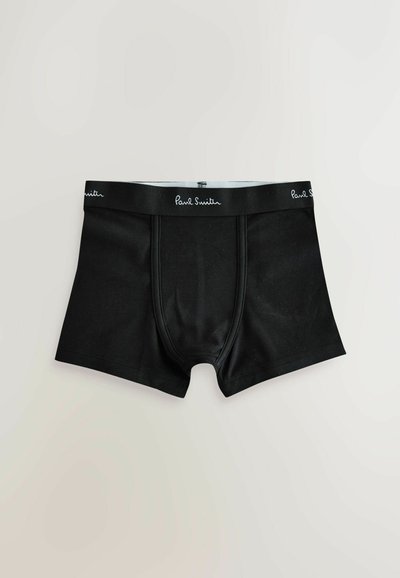 Boxers pour hommes noirs avec couture visible sur le devant et une ceinture noire arborant le logo Paul Smith en écriture blanche.