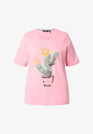 Pink cotton t-shirt featuring a cactus graphic with yellow flowers and the text "DON’T TOUCH ME" on a light pink background. Short sleeves.