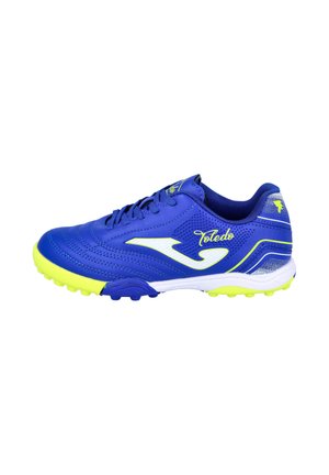 Bota de fútbol azul y amarillo neón con suela blanca, cordones y texto "Toledo" en el lateral, mostrada en un perfil derecho.