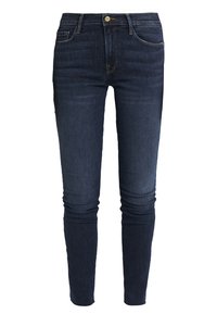 Jeans skinny de color azul oscuro con botón frontal, cremallera y diseño de cinco bolsillos, mostrados sobre un fondo blanco.