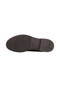 Suela de un zapato negro, con material de goma de superficie texturizada, tacón liso y un pequeño detalle recortado cerca del arco.