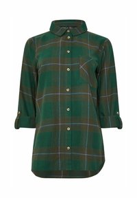 Camicia a quadretti verdi con colletto, chiusura frontale a bottoni e una tasca sul petto. Le maniche arrotolate presentano dettagli in metallo dorato.