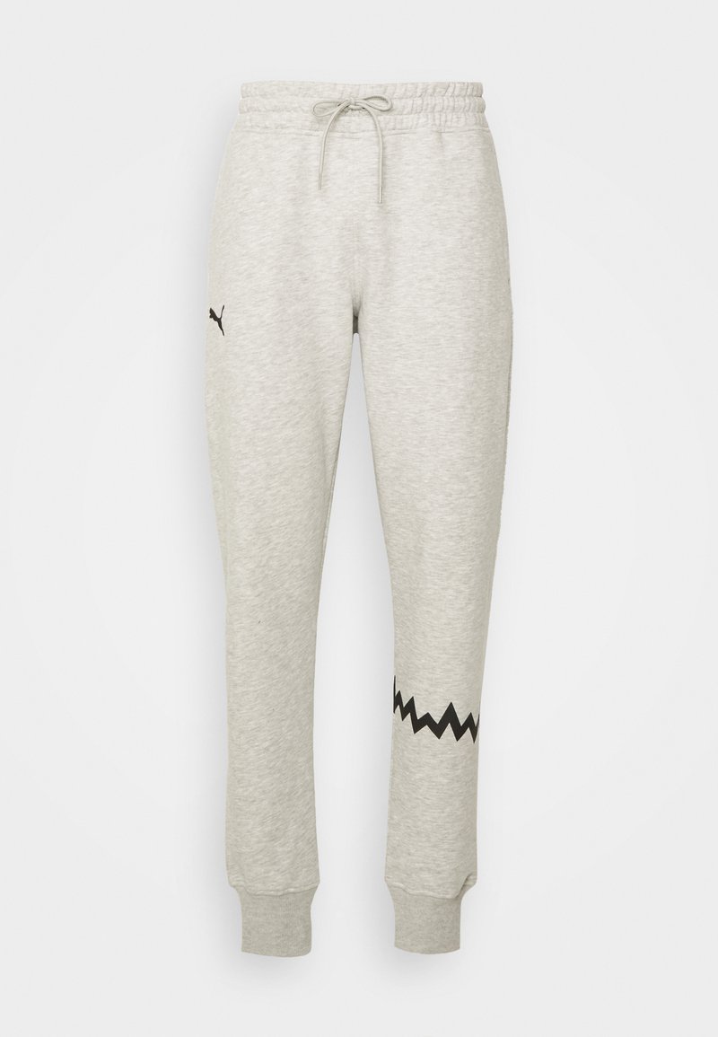 Pantaloni jogger grigi chiari con vita elasticizzata e coulisse, caratterizzati da un motivo a zigzag nero vicino alle caviglie e un piccolo logo.
