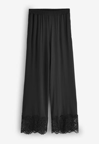 Fekete culotte nadrág elasztikus derékrésszel. A szegélyen csipkedíszítés található, amely textúrát és részletességet ad. Simább anyag.