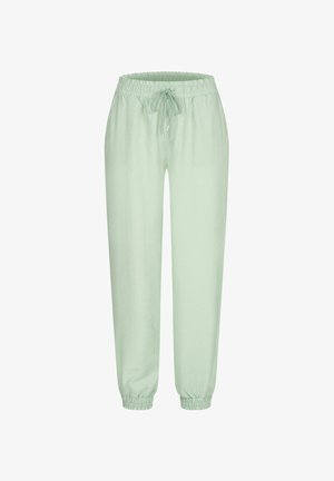 Lys grønne joggebukser med elastisk midjebånd, snøring og elastiske mansjetter. Glatt stoff uten synlige mønstre eller utstyr.
