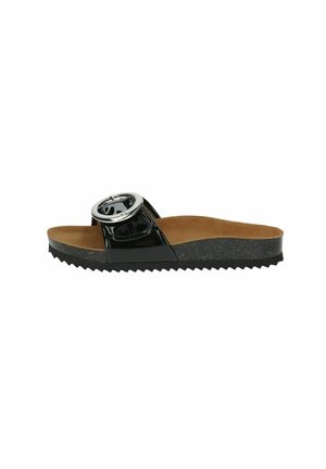 Black slide sandal with a glossy finish, featuring a large circular metallic accent. Textured tan footbed and ridged black outsole.