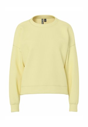 Felpa gialla in tessuto morbido, con scollo rotondo, spalle scese e polsini e orlo a costine. Design semplice e senza decorazioni.