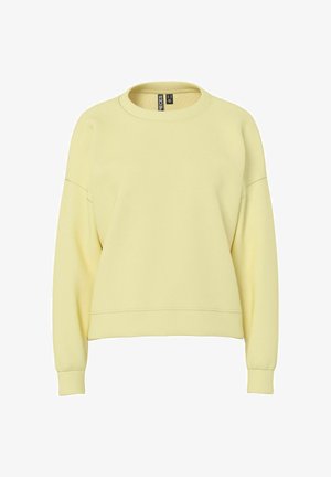 Żółta bluza z miękkiego materiału, z okrągłym dekoltem, opuszczanymi ramionami oraz ściągaczami przy mankietach i na dole. Prosty i nieozdobiony design.