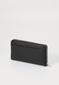 Black leather wallet with a pebbled texture, slim rectangular shape, zip closure, and a single card slot on the back. Silver hardware accent.