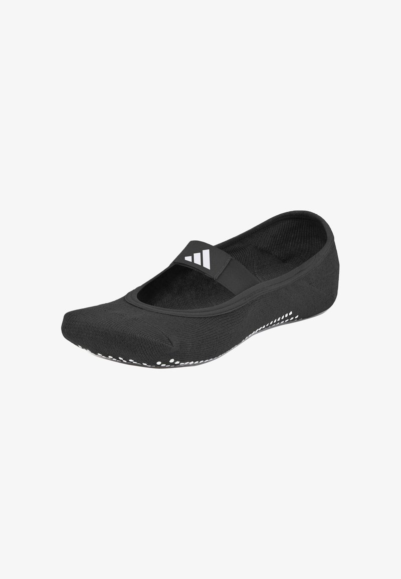 Zapatilla deportiva negra de tipo slip-on con parte superior de punto texturizado, banda elástica ancha y suela blanca con patrón para un mejor agarre.