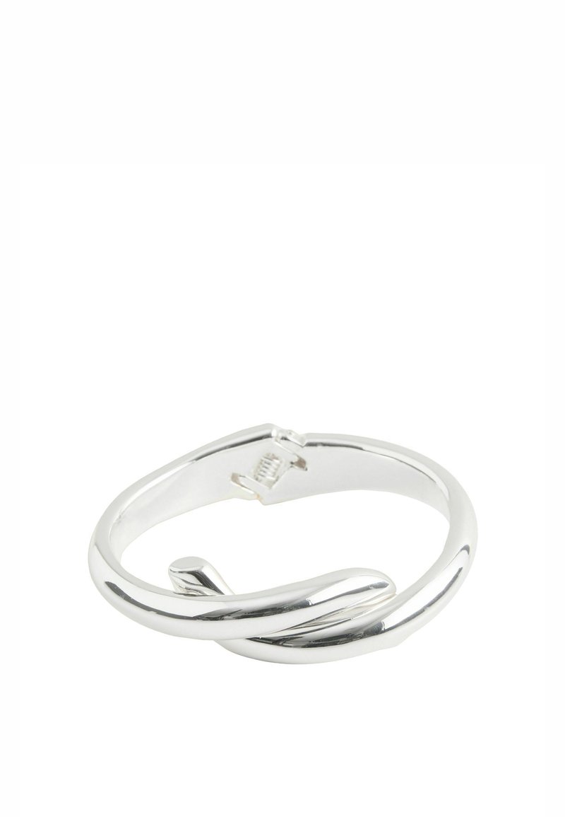 Silver-toned metal ring with a smooth, twisted design. Features a polished finish and a subtle clasp for secure wear.