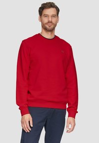 Rode sweatshirt van katoenmix, met een ronde hals, lange mouwen, geribbelde manchetten en een klein logo detail op de borst.