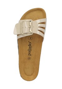 Sandalo color crema con finitura lucida, dotato di una fibbia metallica, design con tagli e una soletta in sughero testurizzato.