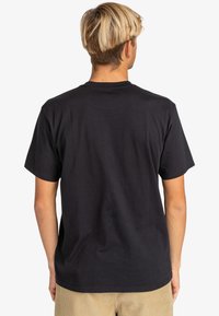 Black cotton t-shirt with a crew neck and short sleeves, featuring a plain back design. No visible logos or patterns.