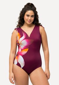 Bordeaux eenpiece badpak met een bloemenprint in roze en oranje. Bevat een v-hals en verstelbare bandjes met rimpel-details.