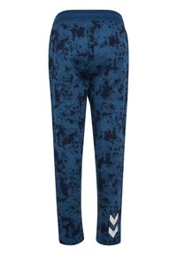 Blauwe sportbroek met een patroon en een textuurdesign, voorzien van een effen tailleband en een witte chevronaccent bij de zoom.