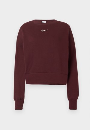 Burgundiszínű, rövidített pulóver, kerek nyakkivágással, hosszú ujjal és egy kicsi, fehér Nike logóval a mellrészen. Puha pamut anyag.
