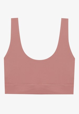 Roze naadloze bralette met brede banden, lage ronde halslijn en een gladde textuur. Geen zichtbare bevestigingsmiddelen of extra accenten.
