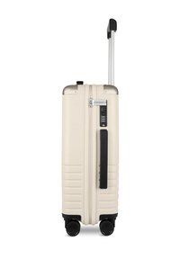 Hartschalenkoffer in Creme mit silberner Oberseite und schwarzen Akzenten. Verfügt über einen teleskopischen Griff, ein TSA-Schloss und vier Spinner-Rollen.