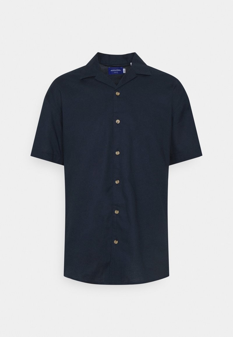 Kortärmad marinblå skjorta i bomullstyg. Har en klassisk krage och en knappstängning framtill med guldfärgade knappar. Slät textur.