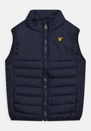 Gilet rembourré bleu marine avec un col haut, fermeture éclair à l'avant et un petit logo brodé jaune sur la poitrine gauche. Détails en tissu matelassé.