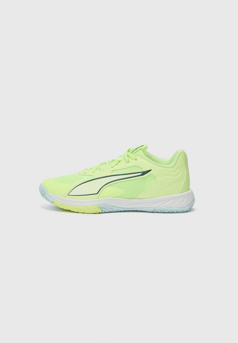 Bright yellow athletic shoe featuring a mesh upper, a cushioned sole, and a curved design with a contrasting dark green accent line.