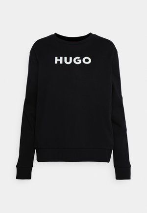 Zwarte crewneck sweatshirt van katoen, met een witte "HUGO" logo over de borst. Geribbelde manchetten en zoom voor extra structuur.