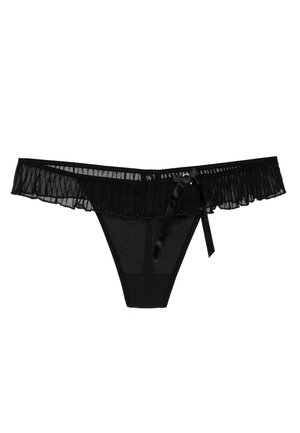 Tanga negro con material de malla transparente, con un borde con volantes, detalle de lazo de satén y un acabado suave y sin costuras en el cuerpo.