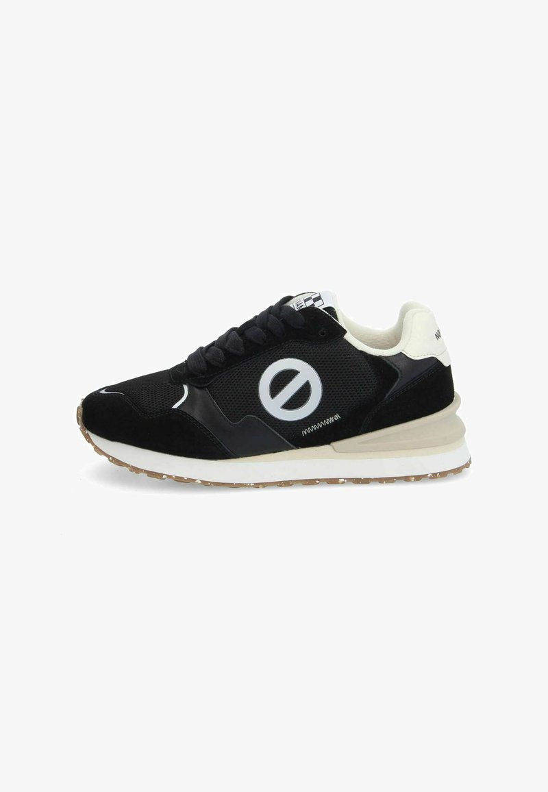 Black and white athletic shoe featuring a breathable mesh upper, suede accents, thick sole, and a circular logo on the side.
