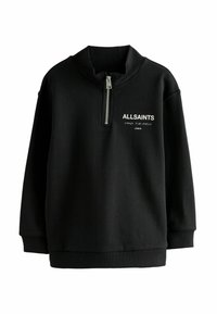Črna majica s kapuco višjega ovratnika, pol zadrgo in rebrastimi manšetami. Na sprednji strani je bel napis "ALLSAINTS" in "LONDON". Mehka tkanina.
