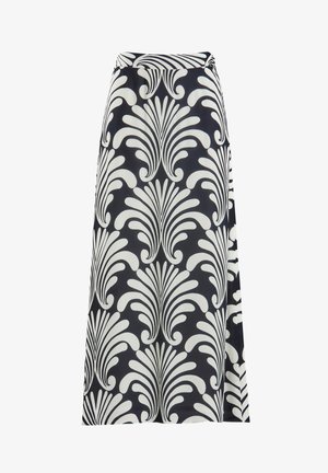 Maxi skirt in navy blue with a bold white floral pattern, featuring an elastic waistband and a flowy design for comfort.