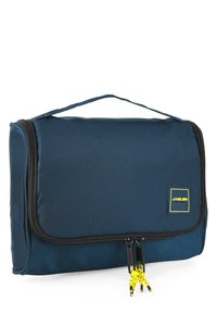 Bolsa organizadora de viaje en azul marino hecha de tejido texturizado, con un asa superior, cierre con cremallera y detalles amarillos en los tiradores de la cremallera.