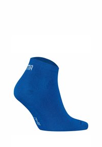 Calcetín azul hasta el tobillo con un puño acanalado, textura suave y talón reforzado. Presenta un logo impreso en blanco en el lateral.