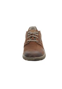 Brown leather shoe with a rounded toe, textured upper, and contrasting laces. Features stitching accents and a rubber sole.
