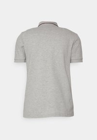 Grey polo shirt with a soft texture, featuring a ribbed collar and short sleeves with subtle dark accent at the collar.