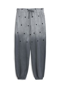 Grijze sweatpants met zwarte stippen, elastische tailleband en boorden. De stof heeft een gladde textuur met een ombre-gradiënt effect.