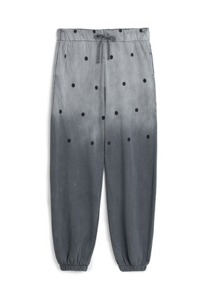 Graue Sweatpants mit schwarzen Punkten, elastischem Bund und Bündchen. Der Stoff hat eine glatte Textur mit einem Ombre-Gradienteneffekt.