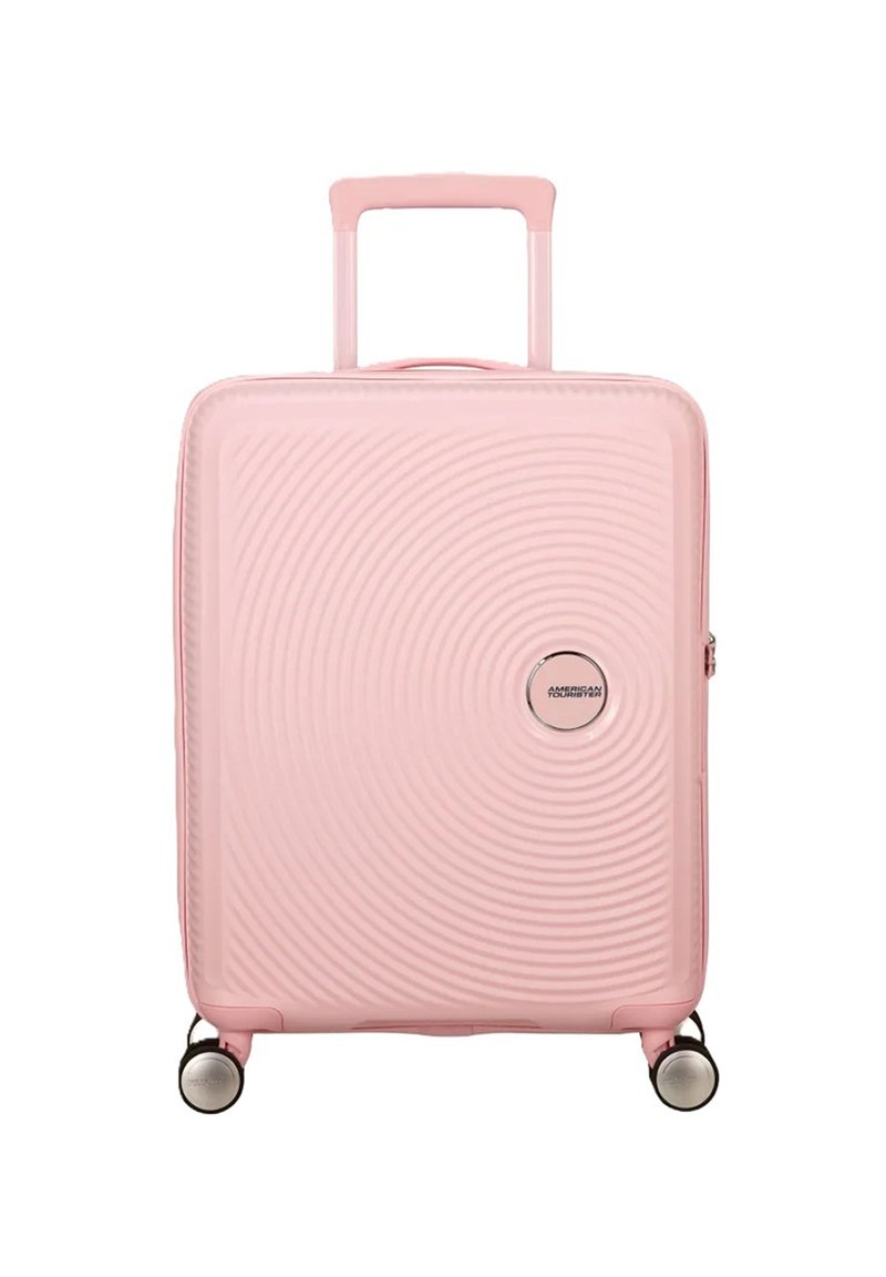 Valigia rigida rosa con motivo a onde, manico telescopico e quattro ruote piroettanti. Presenta un logo rotondo sul frontale.