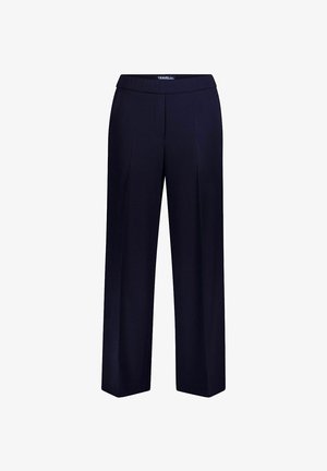 Marineblauwe damesbroek op maat met rechte pijpen, een gladde voorkant en een tailleband met het label "TRAVEL chic".