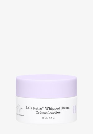 Weißes Glas mit einem lilafarbigen Deckel, beschriftet mit "Lala Retro™ Whipped Cream", 15 ml/.5 fl oz, mit glatter Textur und schlichtem Design.