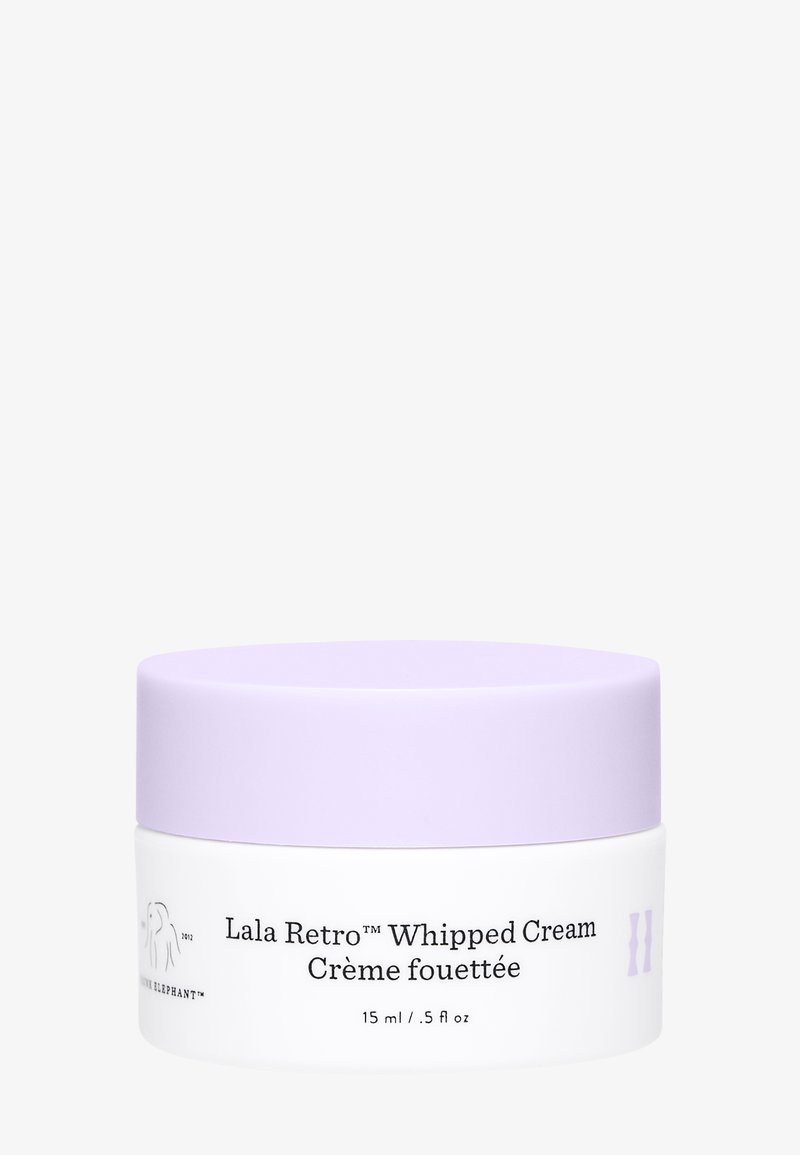 White jar with a lilac lid, labeled "Lala Retro™ Whipped Cream," 15 ml/.5 fl oz, featuring smooth texture and simple design.