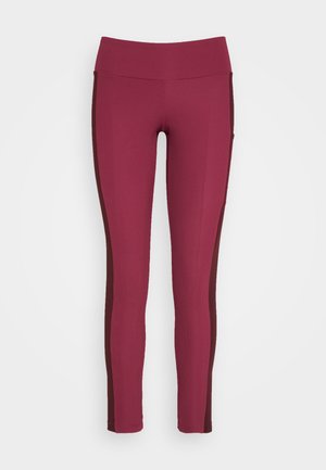 Giliai bordo spalvos šiurkštūs leggingai su kontrastingu tamsiai burgundišku šoniniu paneliu. Vienalytė juosmens juosta, prigludusi forma ir sklandi tekstūra.