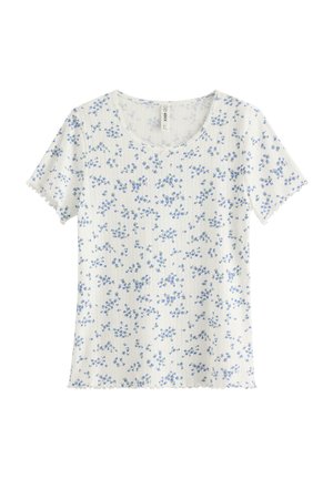 Hvid kortærmet ribbet skjorte med lille blå blomsterprint og bølget kant på ærmer og kant.