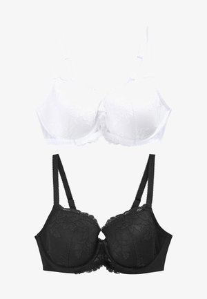 Zwei BHs sind ausgestellt: Ein weißer Spitzen-BH mit geformten Cups und verstellbaren Trägern oben, und ein schwarzer Spitzen-BH mit ähnlichem Design darunter.