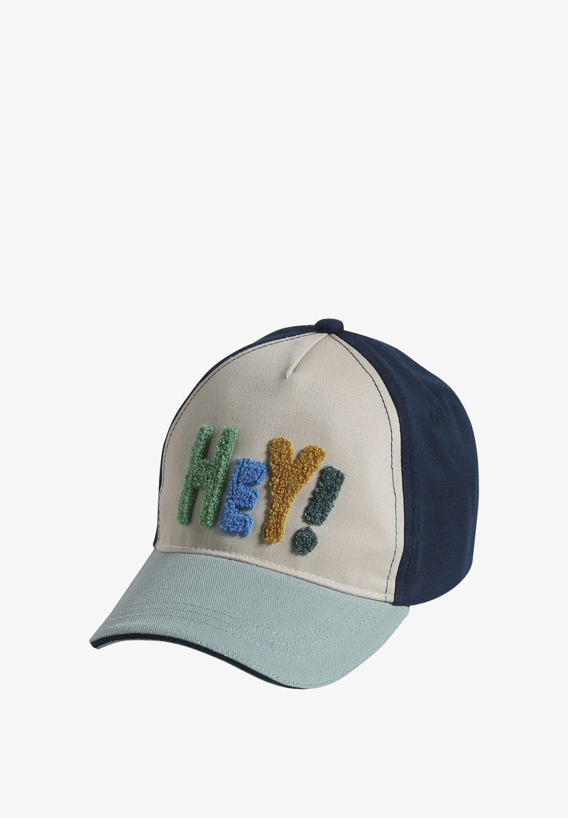 Cap baseball cap with beige front, teal brim, navy sides, and "Hey!" in multicolored textured letters on front panel.